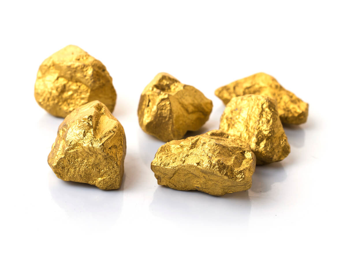 Six gold nuggets on white background