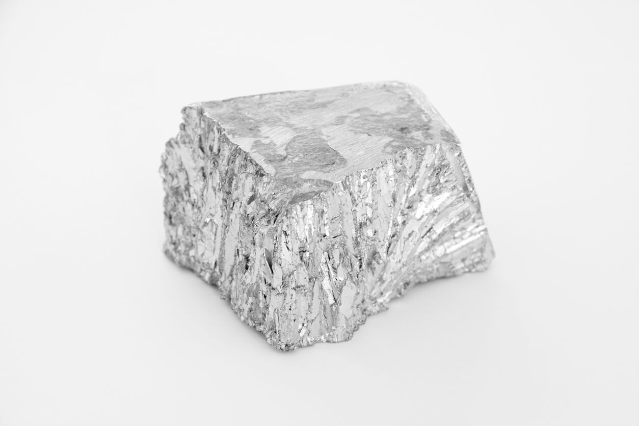Big lump of raw sterling silver on a white background